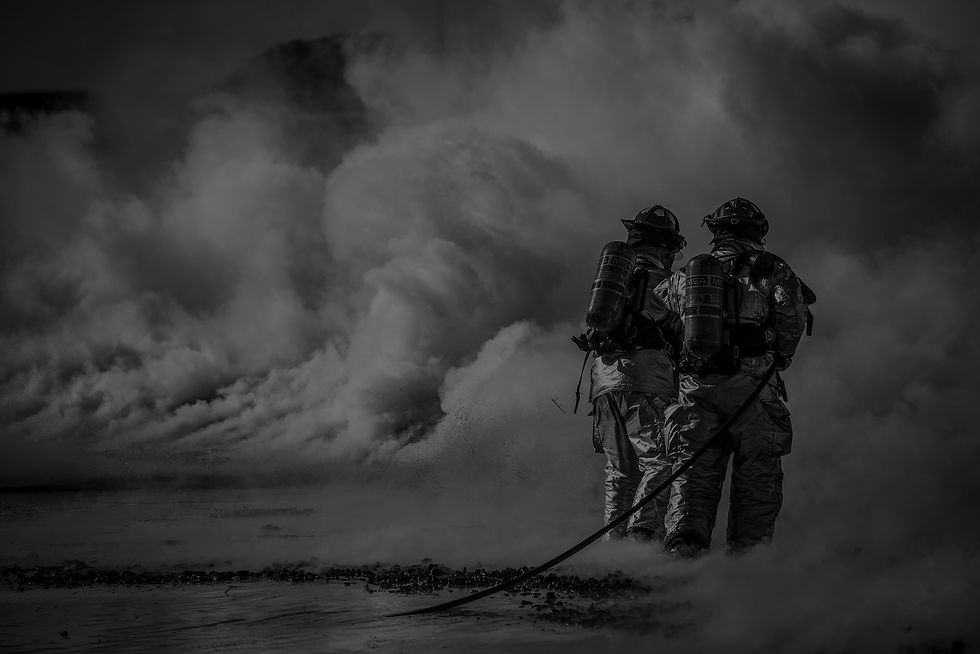 Canva---Firefighter-Standing-Beside-Smok