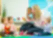 Daycare and teacher playing.webp