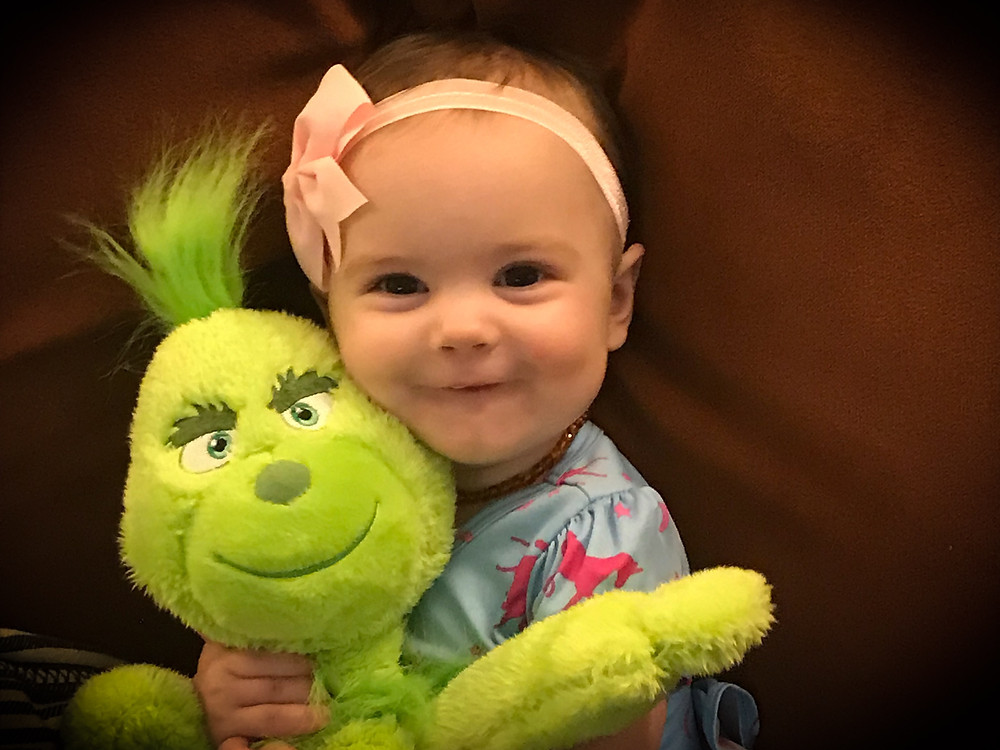 Cute baby holding a stuffed animal