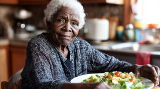 Elderly woman sitting at table 