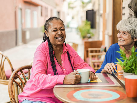 Women laughing in a cafe