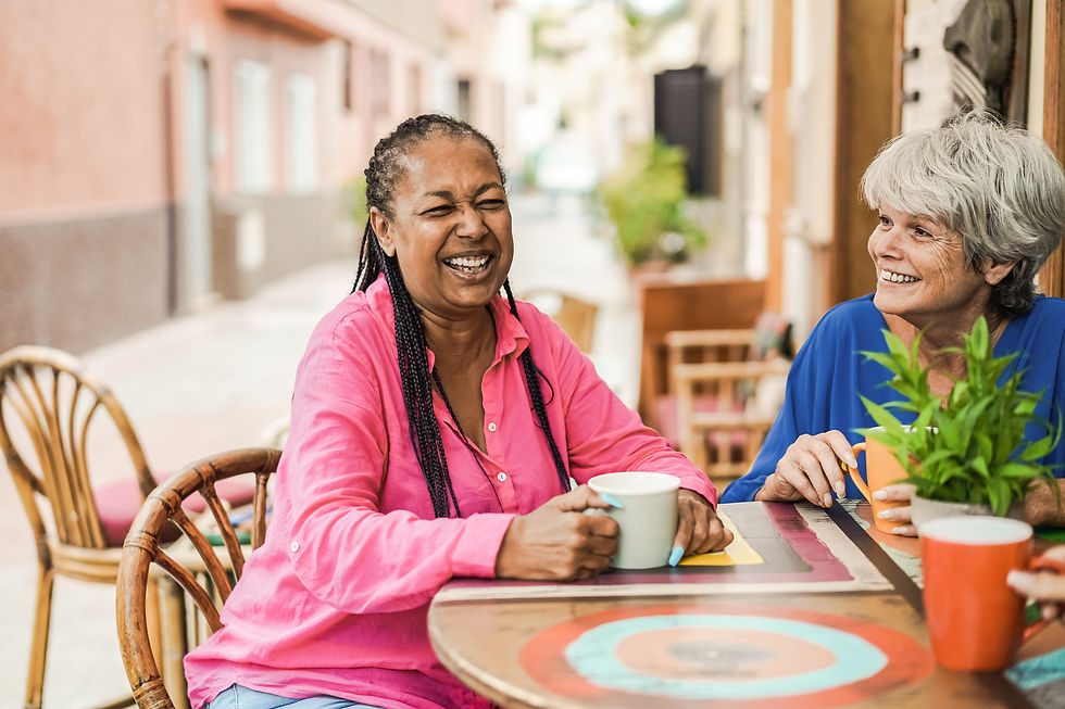 Women laughing in a cafe