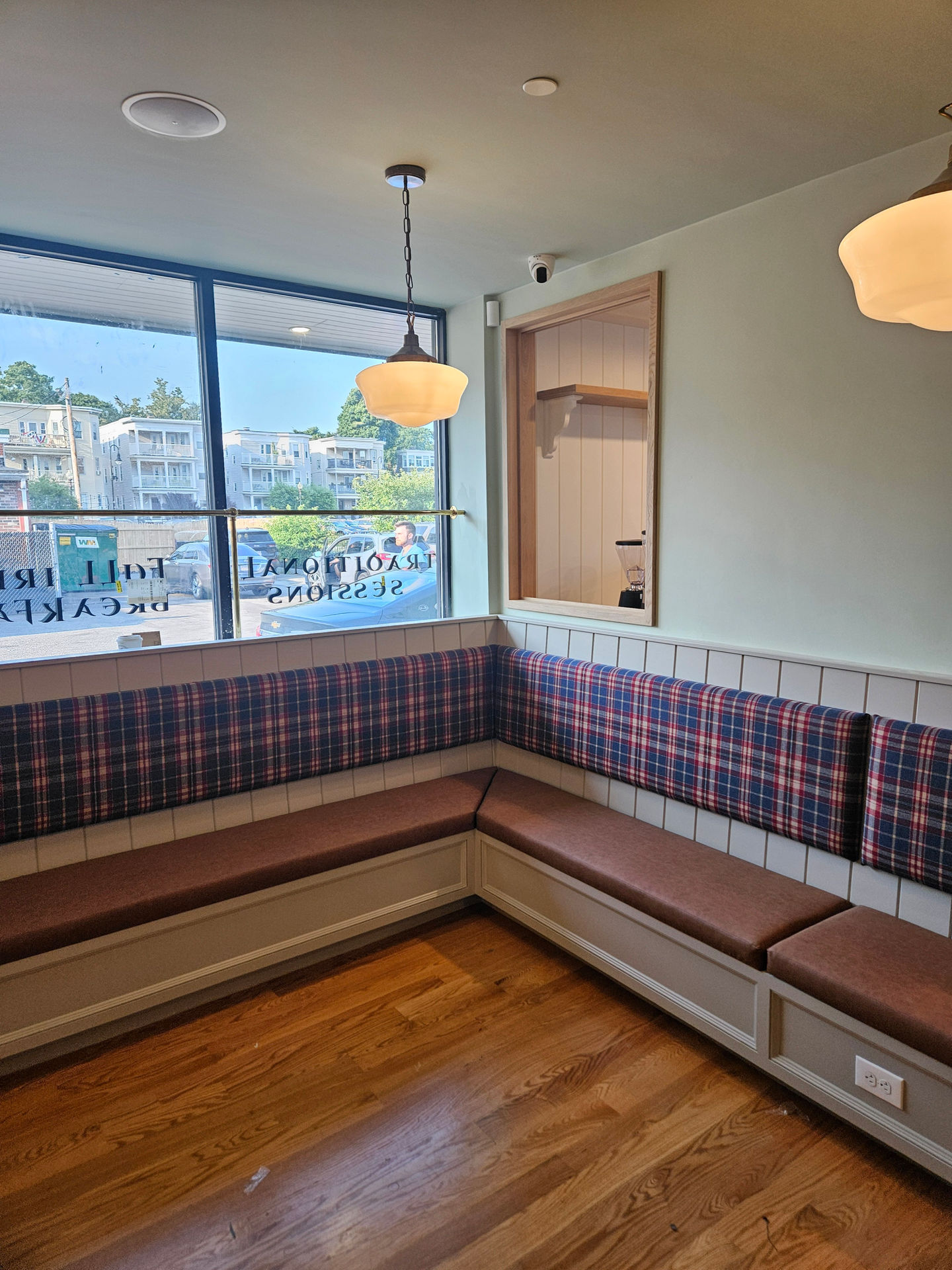 Custom Banquettes crafted by Lousso Designs, featured at Scobie’s Café & Bar in Dorchester, MA