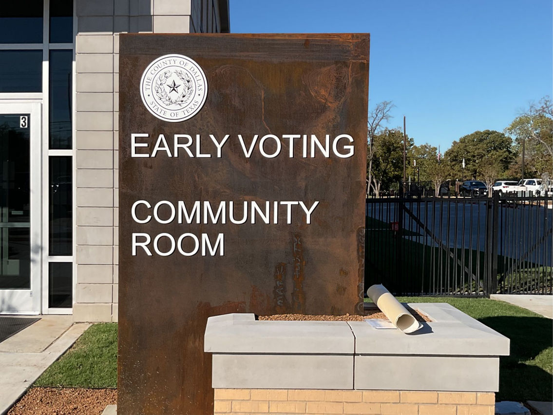 Freestanding monument sign with a brick base for a government building installed by Mello Signs in DFW as a site sign package