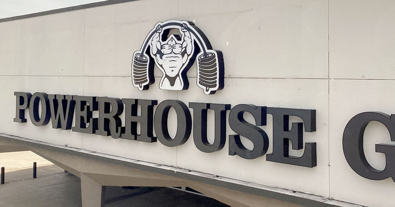 Closeup of the G & Y channel letters for the Powerhouse Gym wall sign installed on the their building by Mello Signs in DFW.