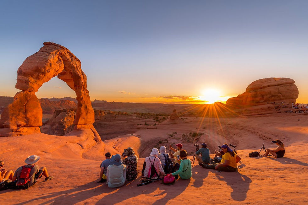 People enjoying the sunset hour at Arches National Park