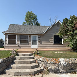 It's Unbeatable! 2 Bedrooms, 1.5 baths, modernly improved with oak kitchen cabinets, laminate flooring, vinyl siding, maintenance free wrap around deck and more. Large entry porch, living room and dining rooms. The basement is finished with laundry and half bath and another room. Detached 2+ stall garage with workshop area. Conveniently located near schools and downtown shopping. 