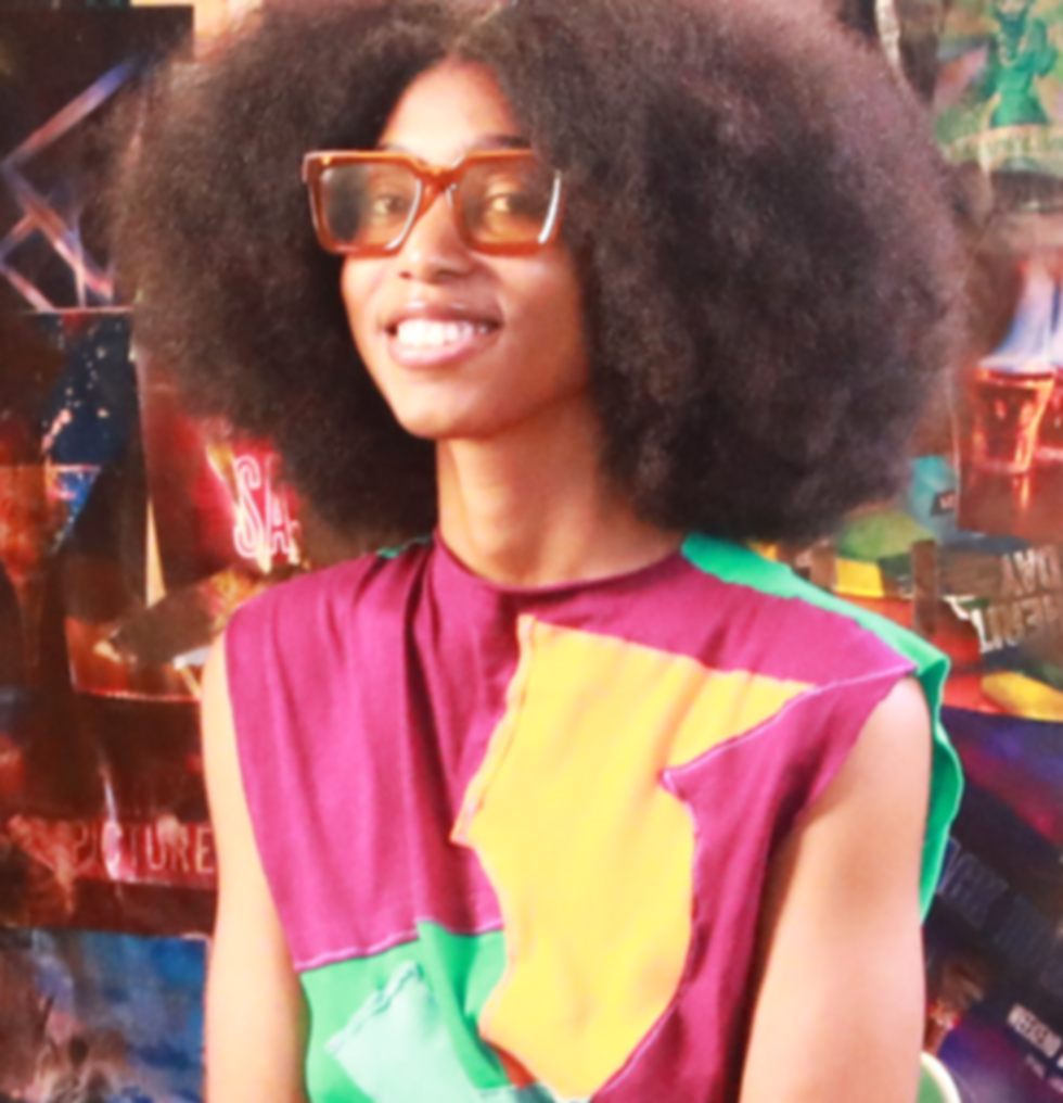 Woman in multi-colored shirt.png