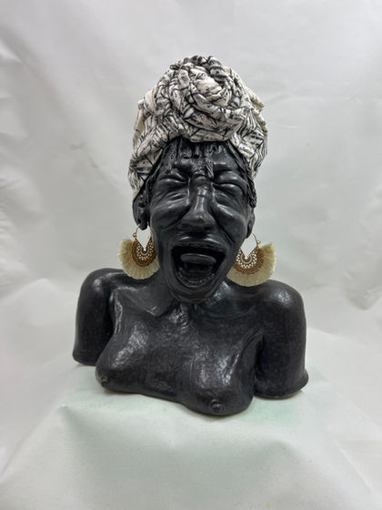 Clay sculpture of lady screaming