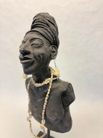 African woman missing right breast.  Pit fired