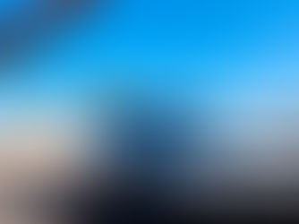 Grey car on the side of the road.