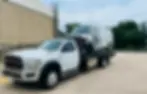 Medium-Duty flatbed hauling a van after a crash in Georgetown Texas.