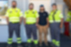 Central Towing & Transport team members standing inside the Fremont shop in high-visibilit