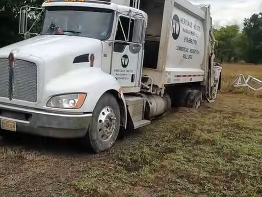 Stuck in the Mud: The Mechanics Behind Pulling a Heavy Garbage Truck to Safety