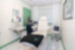 WHite chair with revitalize medspa towels resting on it.