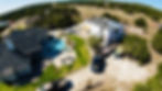 The construction of a residential roof in New braunfels. This home is right behind a home with a finished roof and a brand new pool.