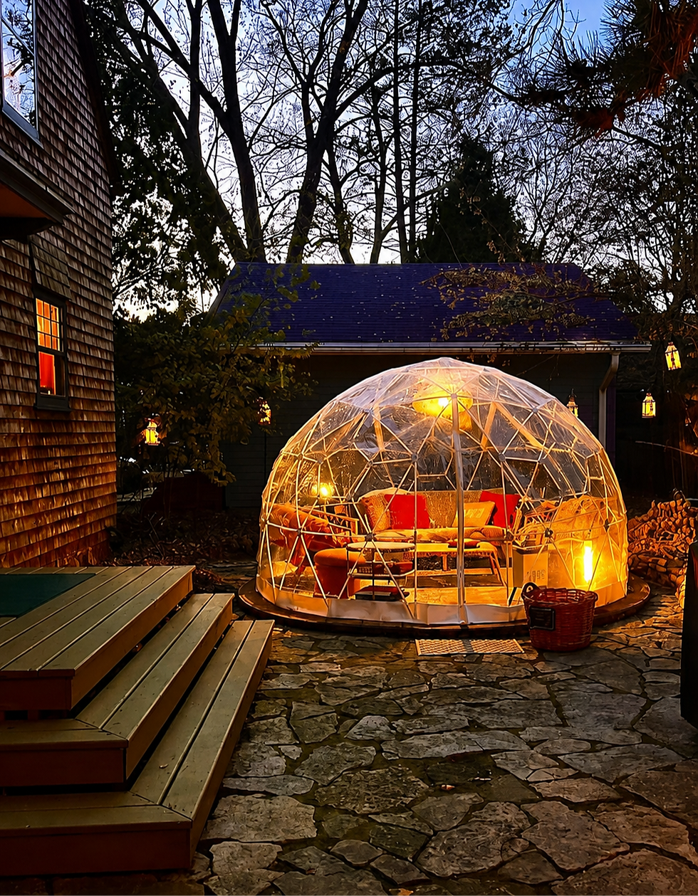 SevenTwenty's heated backyard dome glowing after dark and ready for a night in.