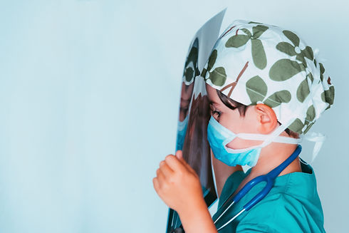 cute-kid-playing-doctor-dressed-as-surgeon-examining-x-ray.jpg