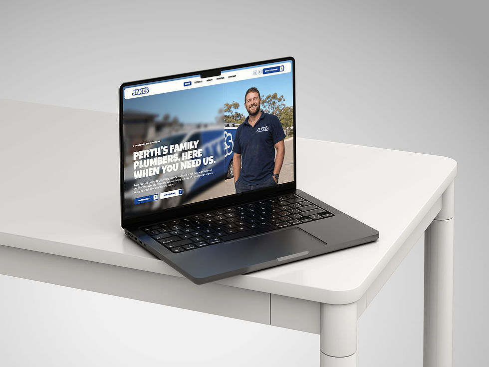 Jake's Plumbing & Gas website homepage displayed on a laptop screen, featuring a Perth plumber and branded van
