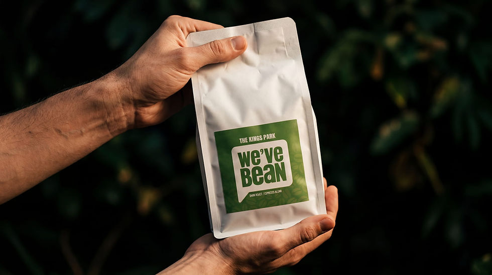 Hands holding white 'we've bean' coffee bag