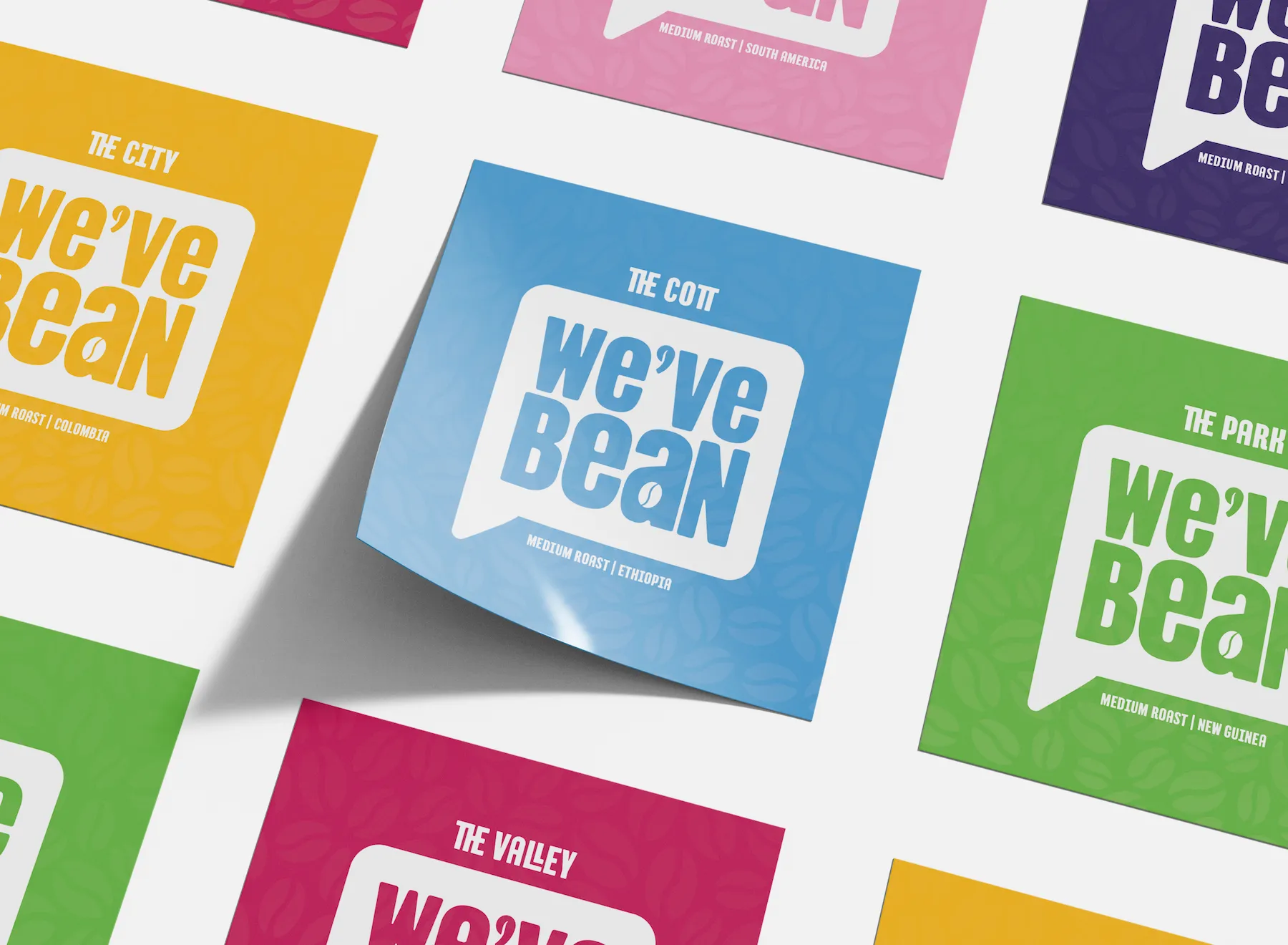Sheet of colourful square "We've Bean" logo stickers in various colours like blue, green, pink, and yellow.