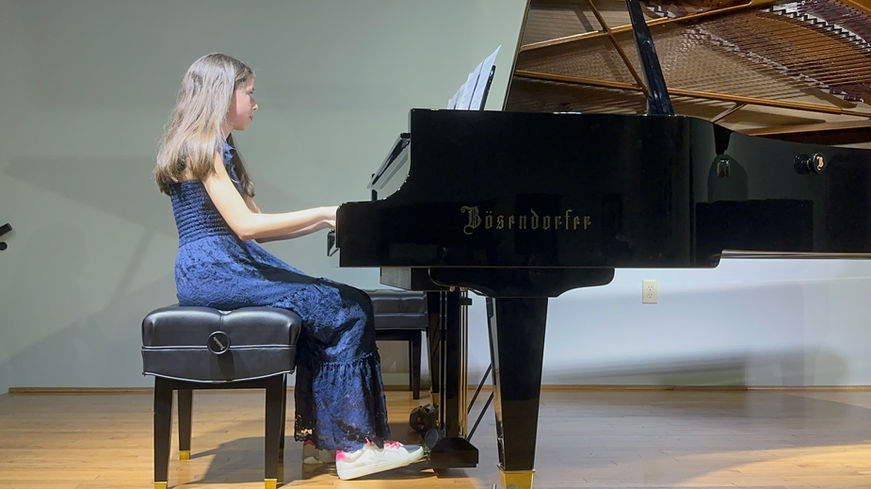 Student Playing Piano at Recital
