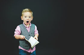 Young boy singing.
