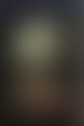 a skull without the bottom jaw wsits on a brown surface with the title in white across it like handwriting