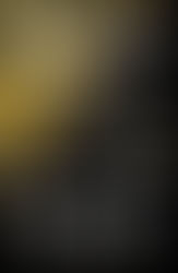 an astronaut on a tether floats in front of a celestial object that is gold and black with white letters