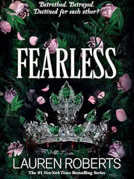a silver crown with green gemstones sits with green bushes and pink roses around it