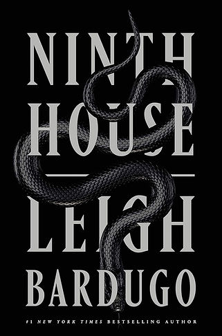 A black Cover with silver words and a black snake slithering through the letters.