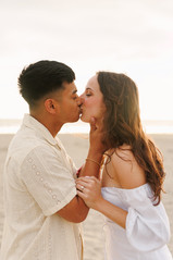 Couple kissing at Cannon Beach for engagement photography