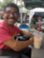 Able ARTS Work Resident Artist, Jesus at Torrance Farmer's market drinking horchata.