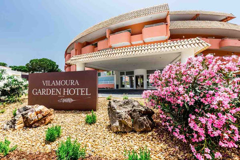 Close-up of Vilamoura Garden Hotel entrance with landscaping