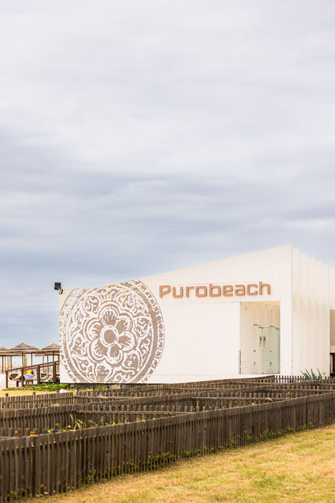Exterior view of Purobeach Algarve entrance with branded signage