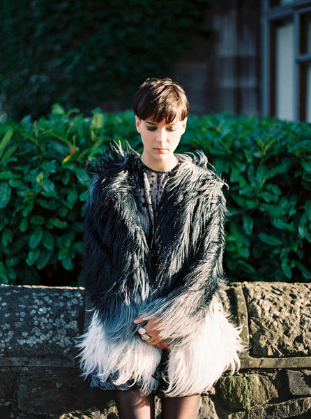 Destination wedding Portugal - Bride in feathered jacket editorial - VIBECULT_