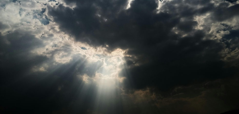 Soft light breaking through dark clouds