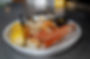 Plate of seafood with corn. Butter sauce. Fat Crabs on a table.