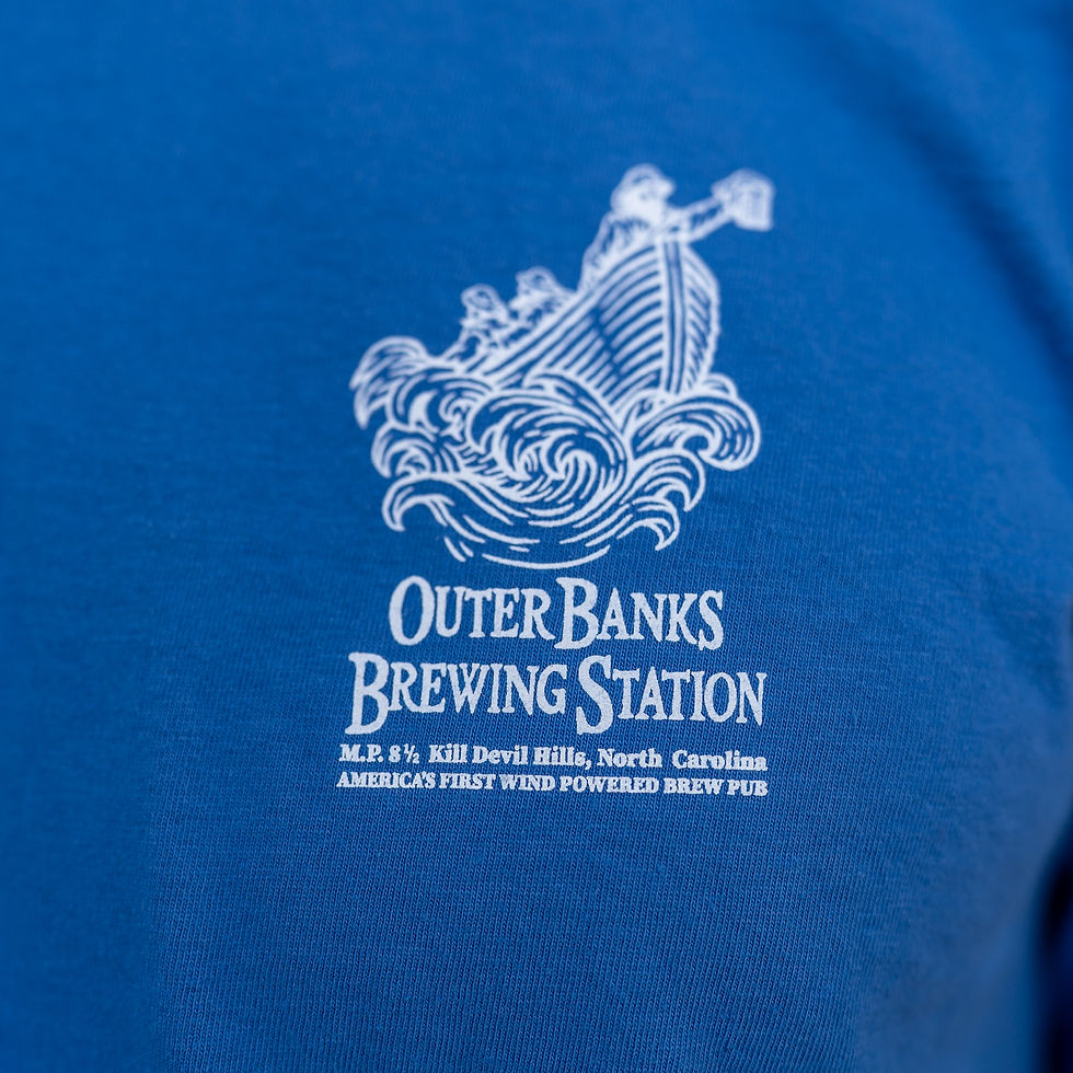 Outer Banks Brewing Station logo with ship on blue fabric