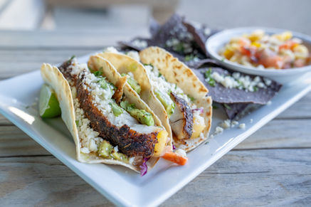 Street Tacos, with local fish, Cotija, Jicama Slaw, and house Crema