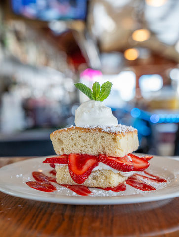 Strawberry shortcake with whipped cream; dessert plate at Kill Devil Grill