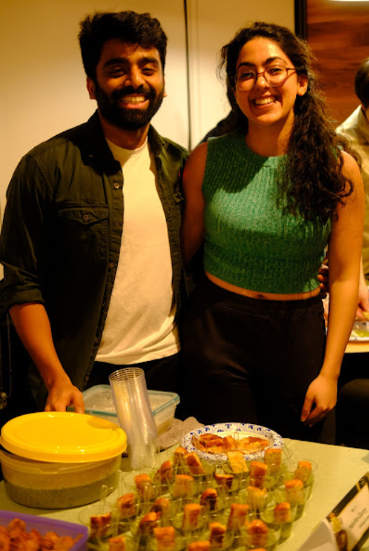 Chefs Akshay Acharya (2Y '26, left) and Gitanjali Jaggi (2Y '26, right) prepare Matcha Curry