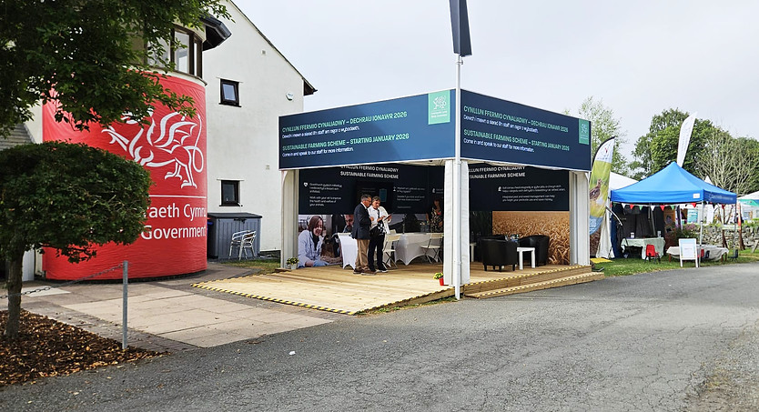 Welsh Government stand at The Royal Welsh show, showing the external with large graphics and seating area