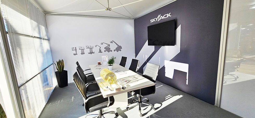 Skyjack Bauma meeting room with AV screen and large graphics