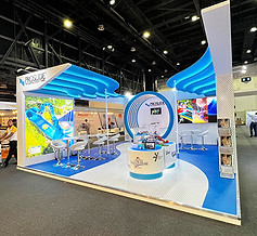 Proslide at DEAL 2023 Exhibition showing branded plinths and seating area.