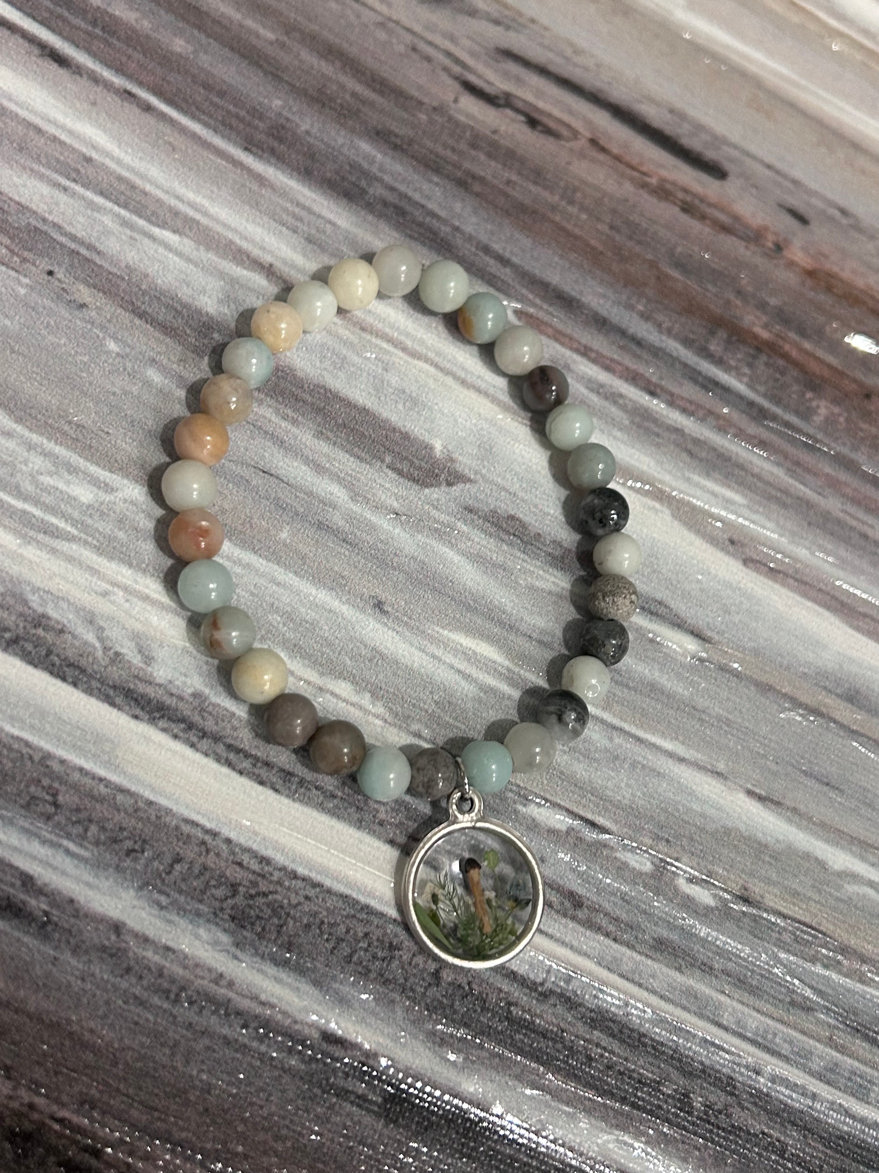 Crystal beaded bracelet with pressed mushroom charm