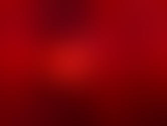 Image of a worker welding through a red plastic film welding courtain. 
