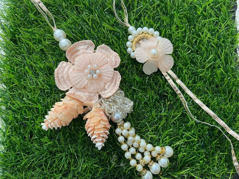 Thumbnail: Handcrafted Pearl Motifs Rakhi Set