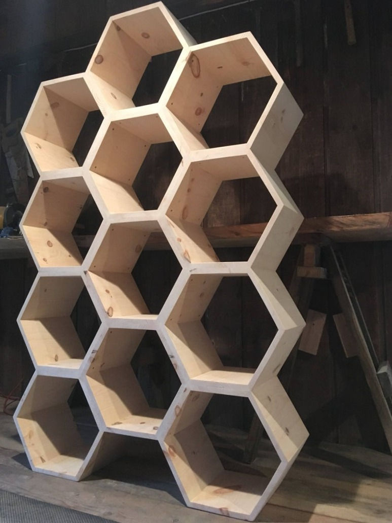 Thumbnail: tall honeycomb shelving unit in unfinished pine wood