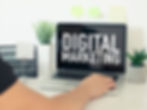 Person searching for digital marketing on a laptop